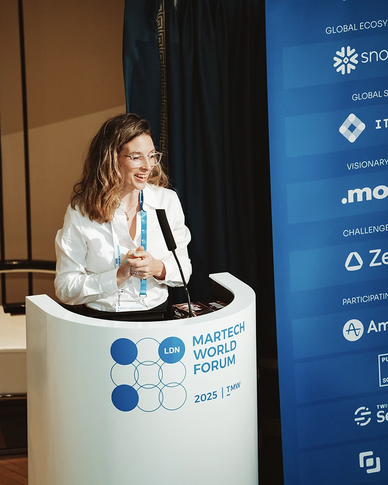 Kerry Guard, MKG Marketing’s Owner/CEO, stands on a street in Guernsey with the Town Church behind her | MKG Marketing